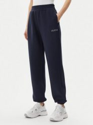 Guess Spodnie dresowe V4BB13 K7UW2 Granatowy Regular Fit. Niebieskie spodnie dresowe damskie Guess, xl, z aplikacjami, z dresówki. Za 299.99 zł.