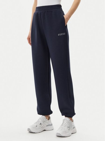Guess Spodnie dresowe V4BB13 K7UW2 Granatowy Regular Fit. Niebieskie spodnie dresowe damskie Guess, m, z aplikacjami, z dresówki. Za 189.99 zł.