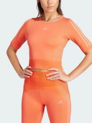 Adidas Koszulka sportowa w kolorze pomarańczowym rozmiar: M. Pomarańczowe koszulki sportowe damskie Adidas, m, bez wzorów, bez ramiączek, outdoorowe. Za 80.52 zł.