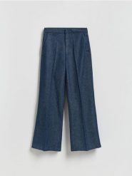 Jeansy flare z kantem - granatowy. Niebieskie jeansy damskie Reserved. Za 129.99 zł.