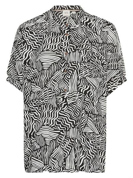 Camel Active Bluzka w kolorze czarno-białym rozmiar: L. Białe bluzki damskie Camel Active, l, bez wzorów, z bawełny, bez kołnierzyka, bez ramiączek. Za 159.95 zł.
