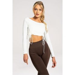 Koszulka fitness damska Gym Glamour regulowana z długimi rękawami. Brązowe koszulki damskie GYM GLAMOUR, s, bez wzorów, bez kołnierzyka, bez ramiączek. Za 149.99 zł.