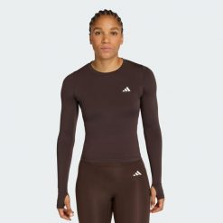 Koszulka Power Essentials Workout Contour Long Sleeve. Brązowe koszulki damskie Adidas, bez wzorów, bez kołnierzyka, bez ramiączek. Za 149.00 zł.