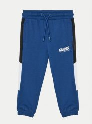 Guess Spodnie dresowe N5RQ11 KA6R4 Niebieski Relaxed Fit. Niebieskie spodnie dresowe chłopięce Guess, z bawełny. Za 99.99 zł.