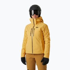 Kurtka narciarska damska Helly Hansen Alphelia Lifaloft sand. Żółte kurtki sportowe damskie Helly Hansen, na zimę, bez wzorów, bez kaptura. Za 2,499.00 zł.