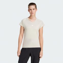 Koszulka AEROREADY Train Essentials Minimal Branding V-Neck. Białe bluzki damskie Adidas, xs, bez wzorów, z materiału, sportowe, bez kołnierzyka, bez ramiączek. Za 109.00 zł.