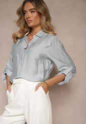 Jasnoniebieska Koszula o Kroju Oversize z Podpinanymi Rękawami Jenitta. Niebieskie koszule damskie Renee, m, bez wzorów, z jeansu, eleganckie, bez kołnierzyka, bez ramiączek. Za 49.99 zł.