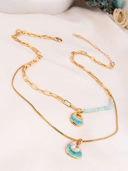 Charlize Pozłacany naszyjnik z akwamarynem - dł. 60 cm rozmiar: onesize. Niebieskie naszyjniki damskie Charlize, z akwamarynem, pozłacane. Za 87.40 zł.