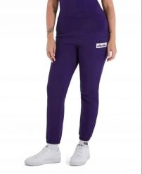 SPODNIE DAMSKIE DRESOWE ELLESSE SPORTOWE NIEBIESKIE. Niebieskie spodnie sportowe damskie Ellesse, m, bez wzorów, z bawełny, na fitness i siłownię. Za 148.09 zł.
