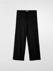 Spodnie dresowe wide leg - czarny. Czarne spodnie sportowe damskie Sinsay, l, bez wzorów, z dresówki, na fitness i siłownię. Za 39.99 zł.