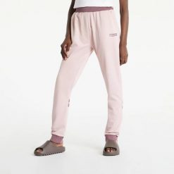 SPODNIE DAMSKIE ELLESSE SPORTOWE DRESOWE RÓŻOWE. Czerwone spodnie sportowe damskie Ellesse, m, bez wzorów, z bawełny, na fitness i siłownię. Za 195.69 zł.