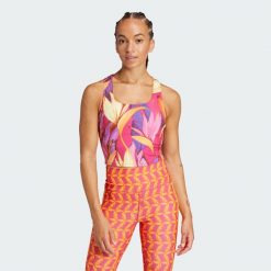 Koszulka adidas x FARM Rio Training Tank. Czerwone koszulki damskie Adidas, xs, bez wzorów, z materiału, bez kołnierzyka, bez ramiączek. W wyprzedaży za 79.50 zł.