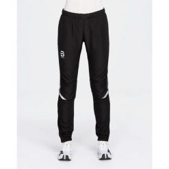 Spodnie narciarskie dla kobiet Daehlie Sportswear Winner 4.0. Czarne spodnie sportowe damskie DAEHLIE, l, bez wzorów, z materiału, narciarskie. Za 545.00 zł.