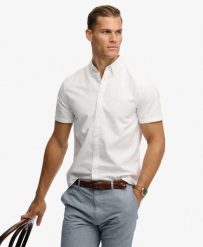 Superdry Koszula Preppy Oxford krótki rękaw z bawełny organicznej – OPTIC. Białe koszule damskie Superdry, m, bez wzorów, z bawełny, casualowe, bez kołnierzyka, bez ramiączek. Za 236.20 zł.