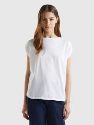 Benetton Koszulka w kolorze białym rozmiar: S. Białe bluzki damskie Benetton, s, bez wzorów, z bawełny, bez kołnierzyka, bez ramiączek. Za 37.30 zł.