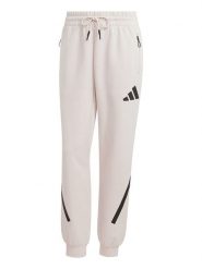 Adidas Spodnie dresowe "Z.N.E." w kolorze kremowym rozmiar: S. Brązowe spodnie dresowe damskie Adidas, s, bez wzorów, z dresówki. Za 152.26 zł.