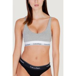 Biustonosz Kobieta CALVIN KLEIN LIGHTLY LINED BRALETTE. Szare biustonosze sportowe damskie Calvin Klein, bez wzorów, z bawełny. Za 178.30 zł.