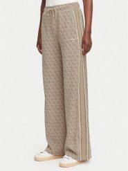 Guess Spodnie dresowe V6YB27 K5181 Beżowy Relaxed Fit. Brązowe spodnie dresowe damskie Guess, xxs, z aplikacjami, z dresówki. Za 474.99 zł.