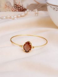 Pierres de Jade Pozłacana bransoletka z cyrkonią rozmiar: onesize. Brązowe bransoletki damskie Pierres de Jade, pozłacane. Za 38.17 zł.