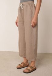 Ciemnobeżowe Spodnie Casual o Kroju Barrel z Wysokim Stanem i Ściągaczem w Talii Kosma. Brązowe spodnie materiałowe damskie Born2be, bez wzorów, z jeansu. Za 79.99 zł.