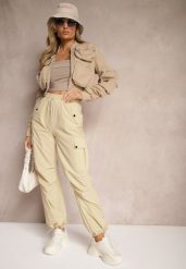Beżowe Spodnie Cargo High Waist z Ozdobnymi Kieszeniami Leriora. Brązowe spodnie materiałowe damskie Renee, bez wzorów, z jeansu. Za 39.99 zł.