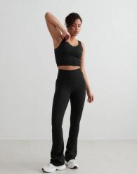 Damskie legginsy rozszerzane z wysokim stanem dla wysokich czarne. Czarne legginsy damskie Aim'n, l, bez wzorów, z elastanu. Za 344.00 zł.