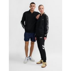 Kurtka z dresu Hummel Hmlarchive Regular Poly. Czarne kurtki damskie Hummel, bez wzorów, z dresówki, bez kaptura. Za 281.05 zł.