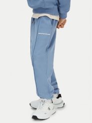 Calvin Klein Jeans Spodnie dresowe Pintuck IB0IB02605 Niebieski Relaxed Fit. Niebieskie spodnie dresowe chłopięce Calvin Klein Jeans, z bawełny. Za 289.99 zł.