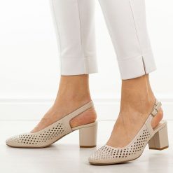 Cieliste ażurowe czółenka damskie na słupku Sergio Leone Sk854. Czółenka damskie Sergio Leone, w ażurowe wzory, ze skóry, z okrągłym noskiem, bez obcasa, na słupku. Za 169.00 zł.