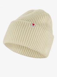 Czapka zimowa Fjallraven Heavy Beanie - chalk white. Białe czapki damskie Fjällräven, na zimę, bez wzorów, z materiału. Za 327.65 zł.