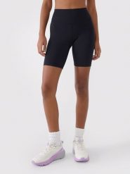 4F Legginsy sportowe w kolorze czarnym rozmiar: L. Czarne legginsy damskie 4F, l, bez wzorów, z materiału. Za 91.99 zł.