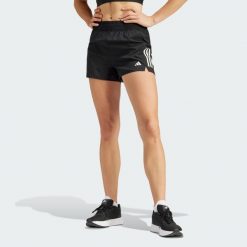 Szorty Own the Run. Czarne obuwie sportowe damskie Adidas, z materiału, bez zapięcia, do biegania. Za 179.00 zł.