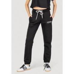 Spodnie Kobieta ICON. Czarne spodnie dresowe damskie ICON, bez wzorów. W wyprzedaży za 284.50 zł.